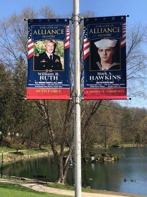 The banners of William Ruth and Mark Hawkins on display in Silver Park.