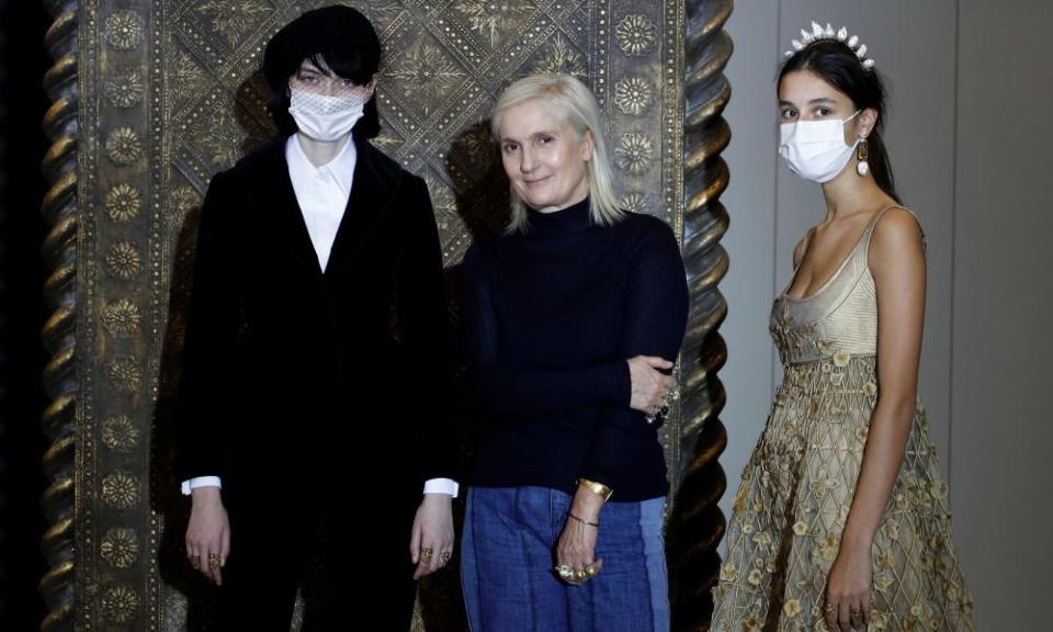 Maria Grazia Chiuri with two models.