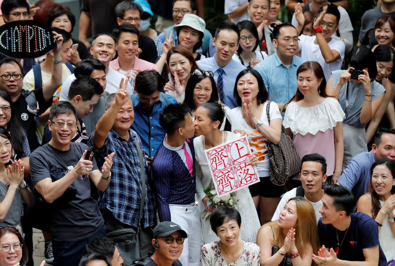 The Wider Image: On trial on riot charges, Hong Kong newlyweds prepared for life apart