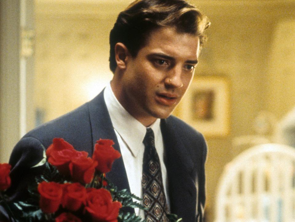 Brendan Fraser holds a bouquet of red roses in this still from "Mrs. Winterbourne."