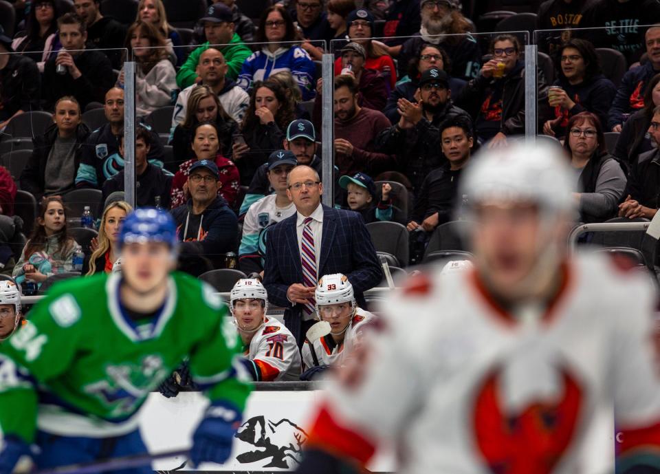 Coachella Valley Firebirds head coach Dan Bylsma watches his team during the first period of their game at Climate Pledge Arena in Seattle, Wash., Sunday, Oct. 23, 2022. 