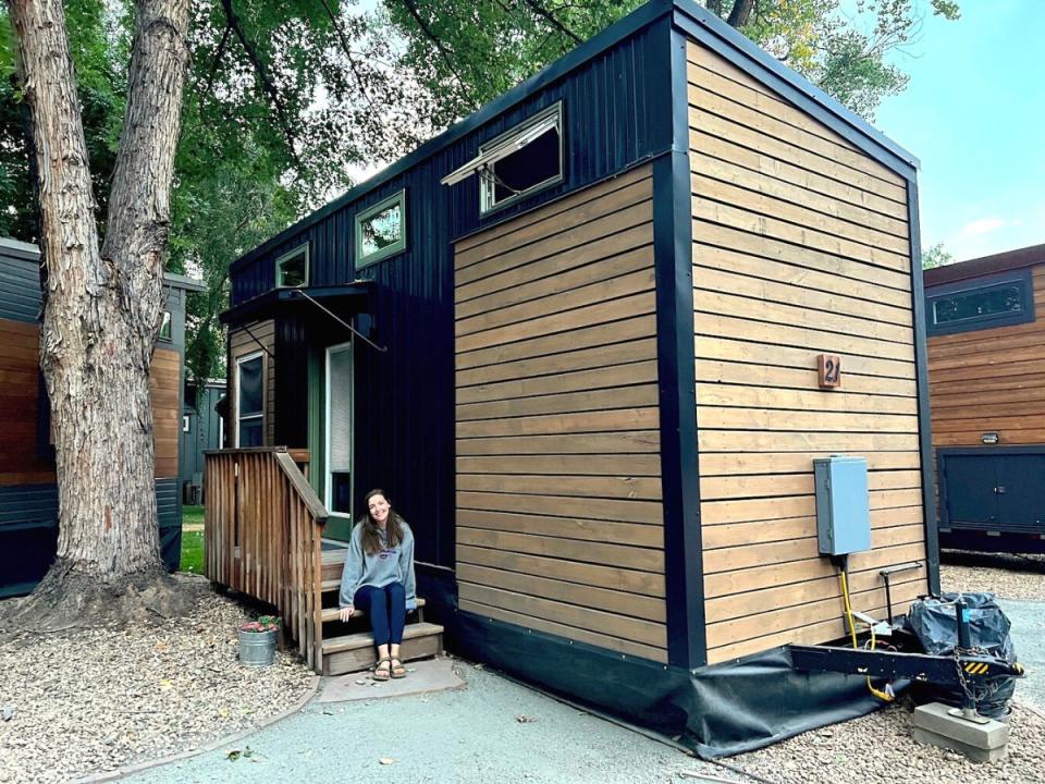 The author in front of a WeeCasa tiny house named Juniper, where the author stayed for two nights.