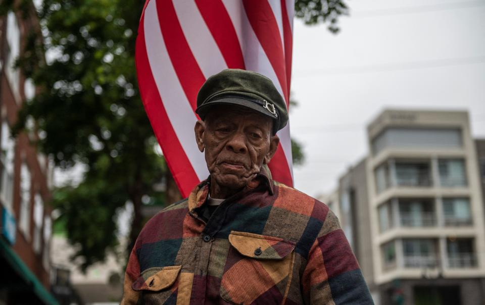 A resident of Tulsa, Okla., tells people about the history of the area in 2021.