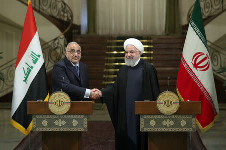 Iranian President Hassan Rouhani shake hands with Iraq's Prime Minister Adel Abdul Mahdi during a news conference in Tehran, Iran, April 6, 2019. Official Iranian President website/Handout via REUTERS