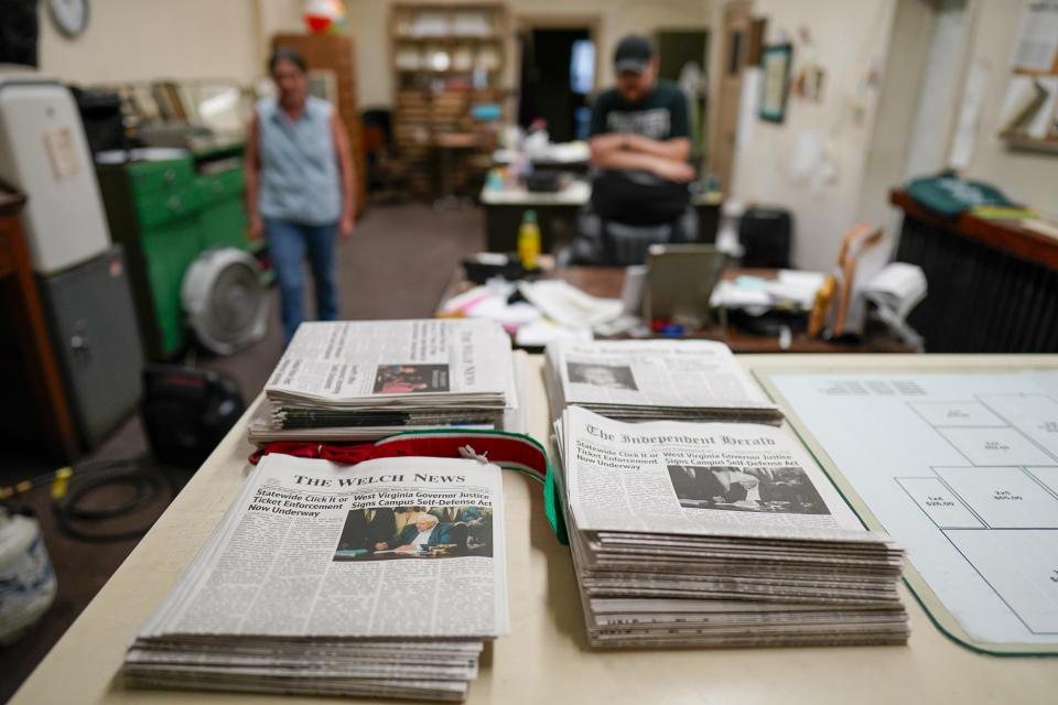 Missy Nester owner of the The Welch News walks around the now closed office on Wednesday, May 31, 2023, in Welch, W.Va. In March, the weekly publication in McDowell County one of the poorest counties America became another one of the quarter of all U.S. newspapers that have shuttered since 2005, a crisis Nester called "terrifying for democracy" and one that disproportionately impacts rural America. (AP Photo/Chris Carlson)