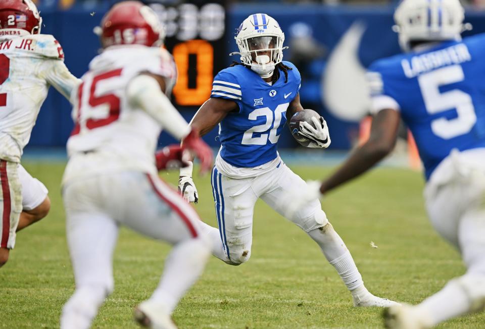 Brigham Young Cougars running back Deion Smith (20) hits the corner as BYU and Oklahoma play at LaVell Edwards Stadium in Provo on Saturday, Nov. 18, 2023. | Scott G Winterton, Deseret News
