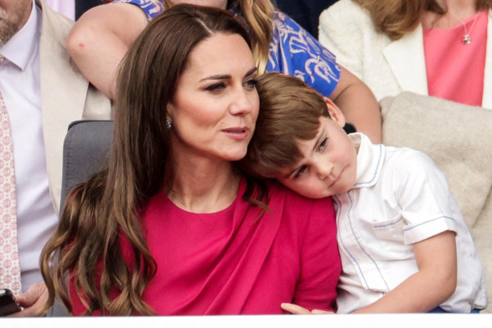 Britain's Catherine, Duchess of Cambridge, (L) is huged by her son Britain's Prince Louis of Cambridge (R) during the Platinum Pageant in London on June 5, 2022 as part of Queen Elizabeth II's platinum jubilee celebrations. - The curtain comes down on four days of momentous nationwide celebrations to honour Queen Elizabeth II's historic Platinum Jubilee with a day-long pageant lauding the 96-year-old monarch's record seven decades on the throne. (Photo by Chris Jackson / POOL / AFP) (Photo by CHRIS JACKSON/POOL/AFP via Getty Images)