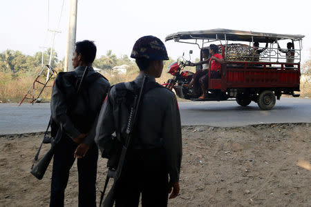 Myanmar policemen stand in a check point outside Rohingya refugee camp in Sittwe, Myanmar March 3, 2017. Picture taken March 3, 2017. REUTERS/Soe Zeya Tun