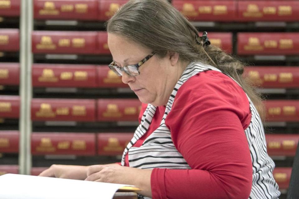 Kim Davis, the county clerk for Rowan County in Kentucky, works with the county election board on Election Day, Tuesday, Nov. 6, 2018, in Morehead, Ky. Davis, who went to jail in 2015 for refusing to issue marriage licenses to same-sex couples, has lost her bid for a second term as county clerk.