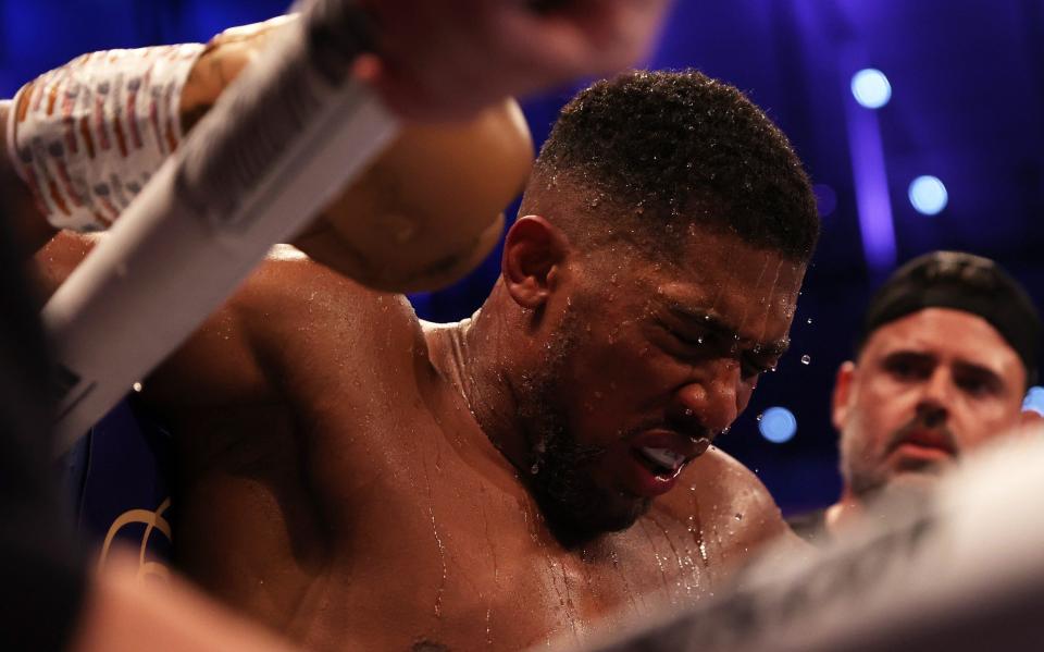 Anthony Joshua cuts a dejected figure following the Heavyweight Title Fight between Anthony Joshua and Oleksandr Usyk at Tottenham Hotspur Stadium on September 25, 2021 in London, England. - Getty Images 