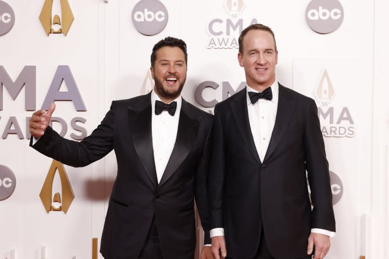 Peyton Manning (R) and Luke Bryan attend the CMA Awards in 2022. File Photo by John Angelillo/UPI