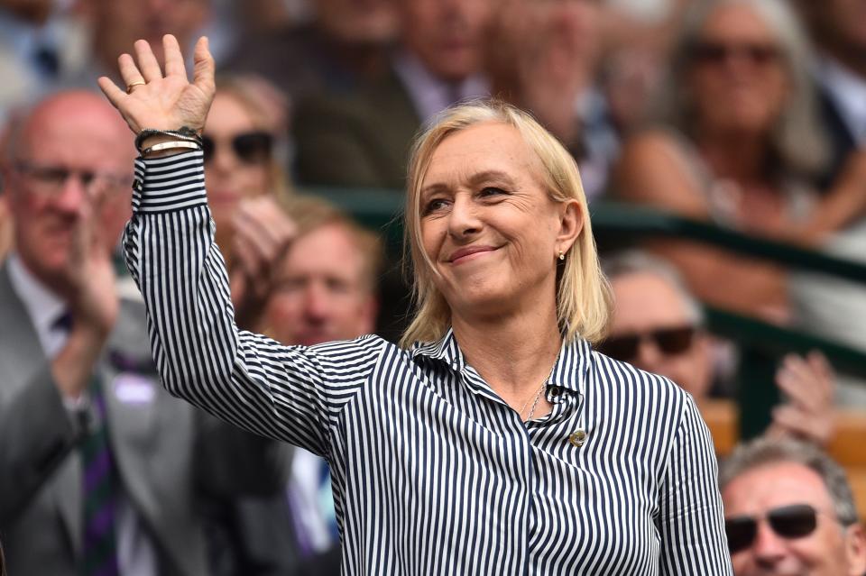 US former tennis player Martina Navratilova waves as she is presented in the Royal Box on Centre Court at The All England Tennis Club in Wimbledon.