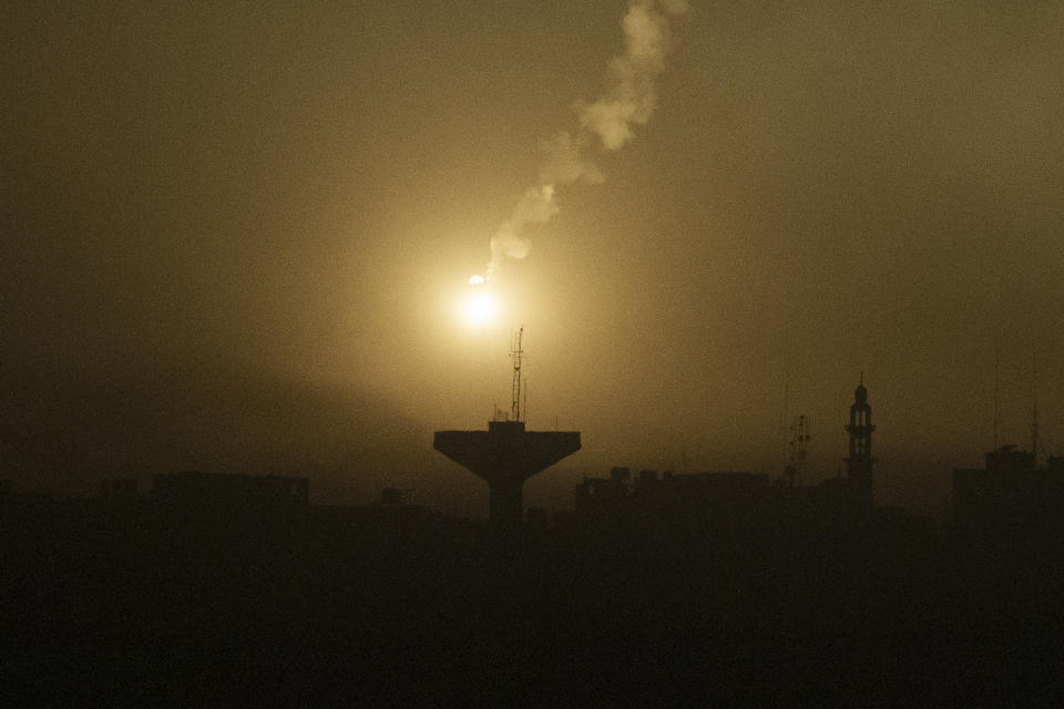 A flare drifts over the Gaza Strip as it illuminates the nigh sky, as seen from southern Israel, Thursday, Nov. 16, 2023. (AP Photo/Leo Correa)