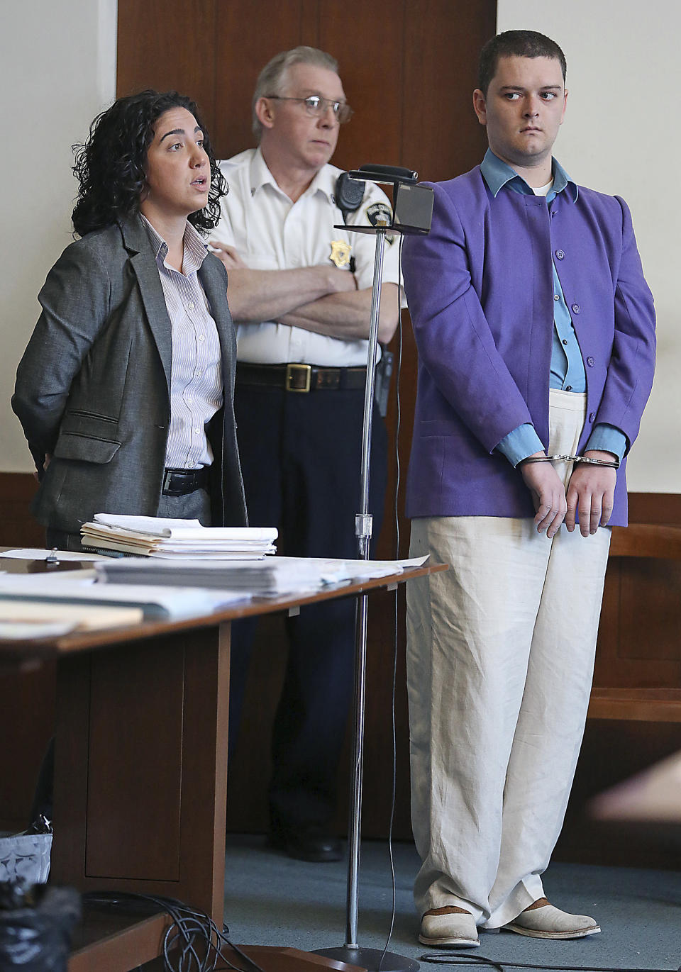 Kevin Edson cries stands a hearing with his attorney, Shannon Lopez, left, in Municipal Court Wednesday, May 7, 2014 in Boston. Edson, accused of a bomb hoax near the Boston Marathon finish line on the anniversary of the 2013 bombing anniversary, was found mentally competent for trial after being evaluated at a state hospital following his April 15 arrest. (AP Photo/Boston Herald, John Wilcox, Pool)