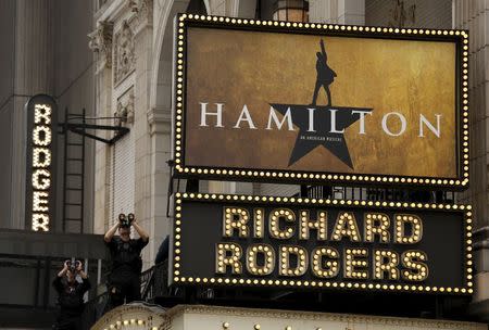 Members of the Secret Service keep watch from the theater rooftop as U.S. President Barack Obama attends the play "Hamilton" with his daughters Sasha and Malia in New York, July 18, 2015. REUTERS/Kevin Lamarque