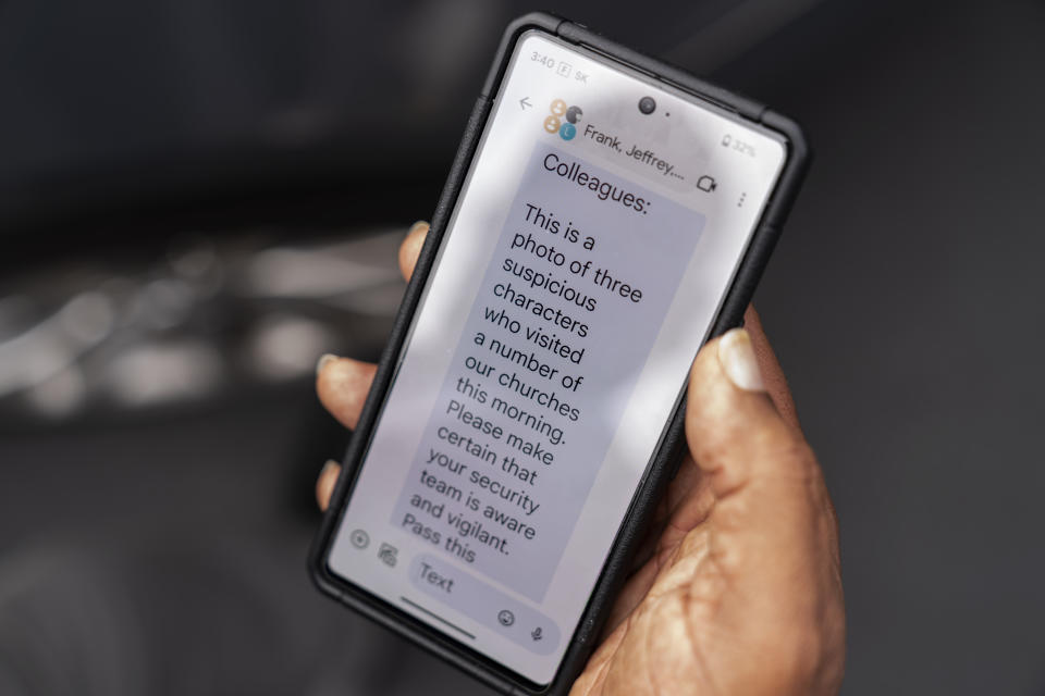 Rev. Jimmie Hardaway Jr. shows a text message he received from a fellow pastor alerting him to some suspicious people who attended an area church service, Sunday, Aug. 20, 2023, in Buffalo, N.Y. (AP Photo/David Goldman)