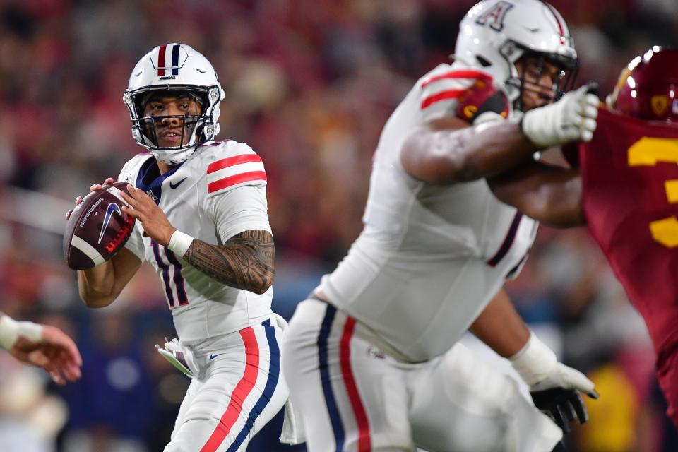 Arizona quarterback Noah Fifita (11) drops back to pass against the Southern California Trojans during the first half, Oct. 7, 2023, at Los Angeles Memorial Coliseum.