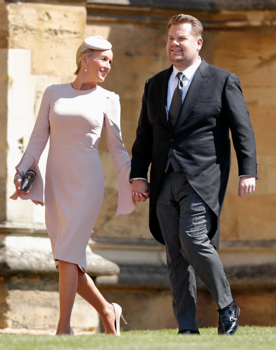 WINDSOR, UNITED KINGDOM - MAY 19: (EMBARGOED FOR PUBLICATION IN UK NEWSPAPERS UNTIL 24 HOURS AFTER CREATE DATE AND TIME) Julia Carey and James Corden attend the wedding of Prince Harry to Ms Meghan Markle at St George's Chapel, Windsor Castle on May 19, 2018 in Windsor, England. Prince Henry Charles Albert David of Wales marries Ms. Meghan Markle in a service at St George's Chapel inside the grounds of Windsor Castle. Among the guests were 2200 members of the public, the royal family and Ms. Markle's Mother Doria Ragland. (Photo by Max Mumby/Indigo/Getty Images)