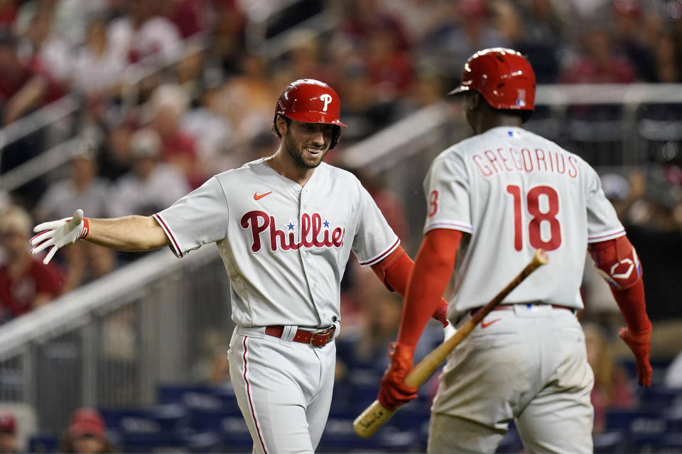 Philadelphia Phillies' Matt Vierling, left, celebrates his solo home run with teammate Didi Gregorius in the eighth inning of the second game of a baseball doubleheader against the Washington Nationals, Friday, June 17, 2022, in Washington. Philadelphia won 8-7 in 10 innings. (AP Photo/Patrick Semansky)