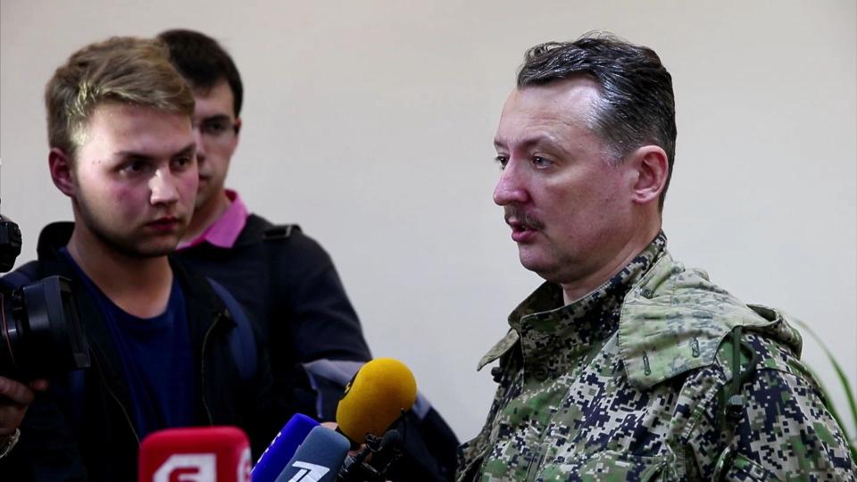 This image taken from Associated Press video shows Igor Strelkov, military commander of pro-Russian militias in Slovyansk talking to journalists in Slovyansk, Ukraine, Sunday, April 27, 2014. Strelkov has been identified as a Russian security services operative by Ukraine's government. In what appeared to be a closely vetted interview to Russian media, Strelkov did not directly deny the accusation, saying the uprising in Ukraine was being carried out by opponents of the "Kiev junta" — language similar in tone to that adopted by the Kremlin leadership. (AP Photo/Associated Press Video)