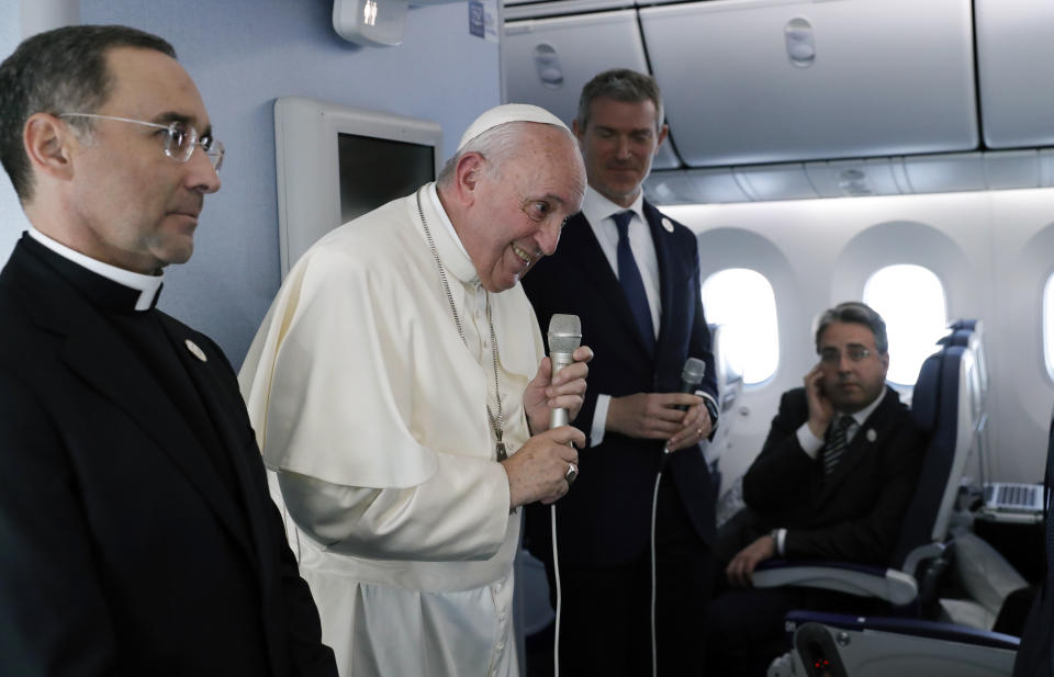 Pope Francis speaks during a news conference onboard the papal plane on his flight back from a trip to Thailand and Japan, Monday, Nov. 26, 2019. (Remo Casilli/Pool Photo via AP)