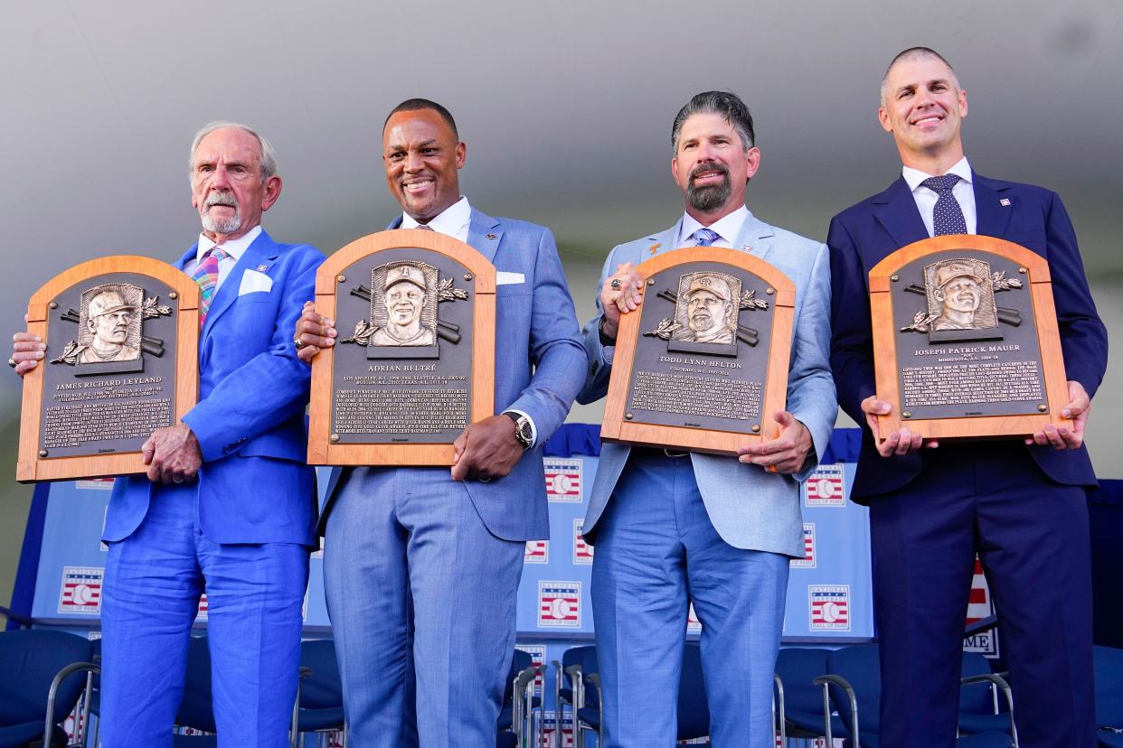 Hall of Fame inductees Jim Leyland, Adrian Beltre, Todd Helton and Joe Mauer pose with their Baseball Hall of Fame plaques.