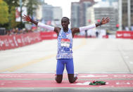 Kelvin Kiptum celebrates his Chicago Marathon world record victory in Chicago's Grant Park on Sunday, Oct. 8, 2023. (Eileen T. Meslar /Chicago Tribune via AP)