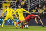 Nov 21, 2017; Columbus, OH, USA; Toronto FC midfielder Jonathan Osorio (21) is fouled by Columbus Crew SC forward Pedro Santos (32) in the first half of the game in the first leg of the MLS Eastern Conference Championship at MAPFRE Stadium. Trevor Ruszkowski-USA TODAY Sports