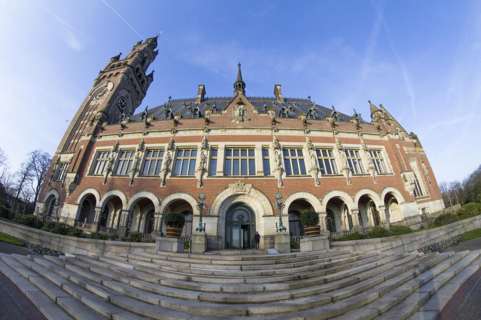 FILE- In this Monday, Feb. 18, 2019, file photo the Peace Palace, which houses the International Court of Justice, or World Court, is seen in The Hague, Netherlands. The United Nations highest court is ruling on U.S. objections to its jurisdiction in in a case brought by Iran against Washington in a bid to end sanctions re-imposed by the Trump administration in 2018 after pulling out of an international deal aimed at curtailing Tehran's nuclear program. (AP Photo/Peter Dejong)