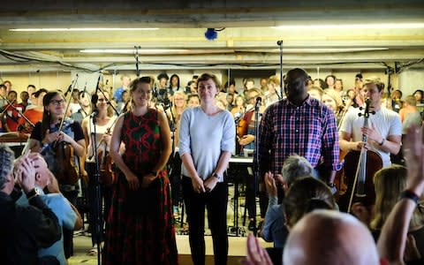 Composer Kate Whitley takes a bow after the performance of her piece I Am I Say with Ruby Hughes, Michael Sumuel and The Multi-Story Orchestra - Credit: Mark Allan/BBC