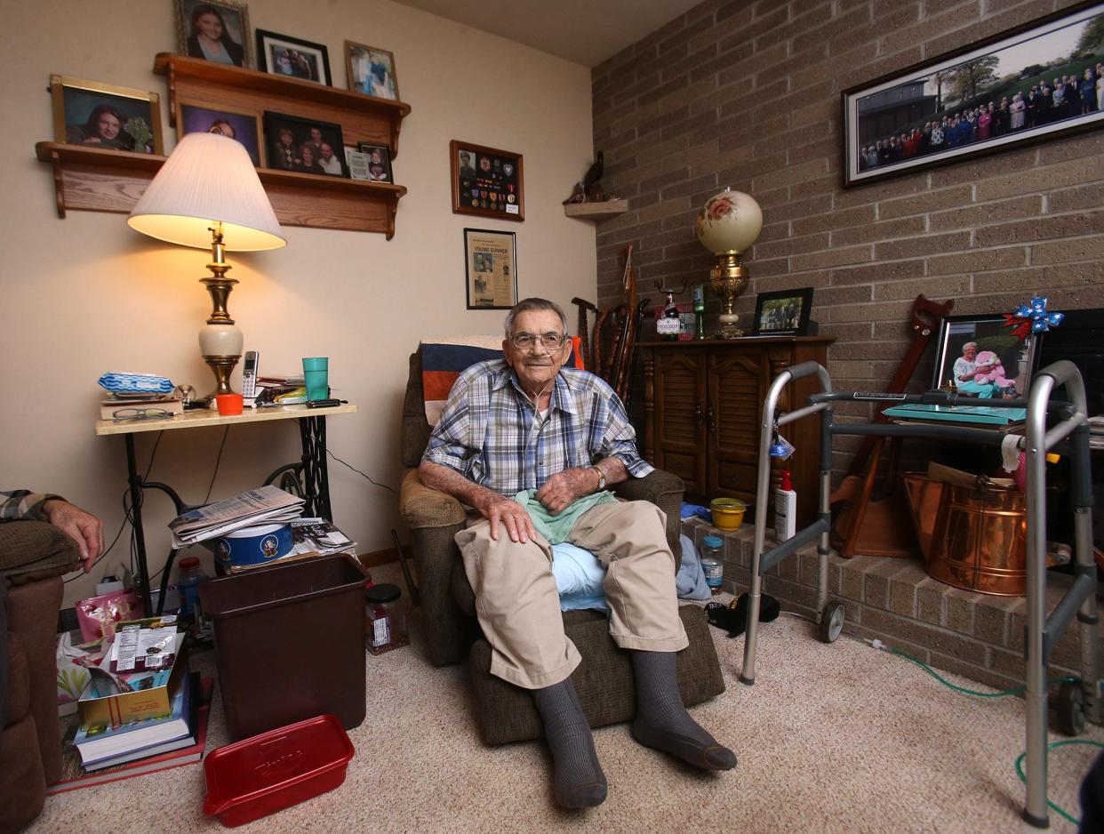 John Adams is surrounded with mementos of his life at his home in Plain Township on Wednesday. The World War II veteran who fought in the South Pacific is among a dwindling number of Americans who served in the war.