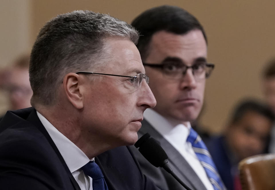 Ambassador Kurt Volker, left, former special envoy to Ukraine, and Tim Morrison, a former official at the National Security Council, testify before the House Intelligence Committee on Capitol Hill in Washington, Tuesday, Nov. 19, 2019, during a public impeachment hearing of President Donald Trump's efforts to tie U.S. aid for Ukraine to investigations of his political opponents. (AP Photo/J. Scott Applewhite)