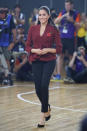 <p>For the 2018 Invictus Games wheelchair basketball final, the Duchess dressed in a £303 wrap-around jacket by Aussie label <a rel="nofollow noopener" href="https://us.scanlantheodore.com/collections/w18-rwt/products/crepeknitwrapjacketgarnet" target="_blank" data-ylk="slk:Scanlan Theodore;elm:context_link;itc:0;sec:content-canvas" class="link ">Scanlan Theodore</a>. She finished the ensemble with a pair of black jeans and block heels. <em>[Photo: Getty]</em> </p>