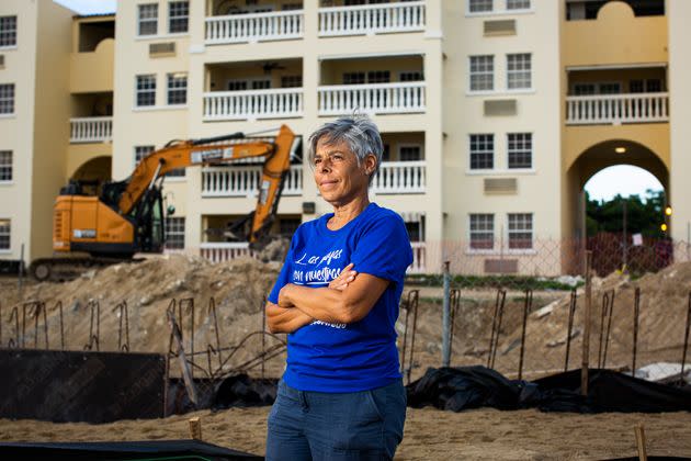 Miriam Juan Rivera, a community leader, stands in front of the Playa y Sol complex at Los Almendros beach on Aug. 2. She was one of the first to join an encampment on the beach to protest the reconstruction of the complex's pool in a nesting area for endangered turtles. (Photo: Erika P. Rodriguez for HuffPost)