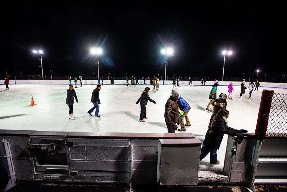Revelers ice skate at the Bear Mountain Ice Rink in Tomkins Cove.