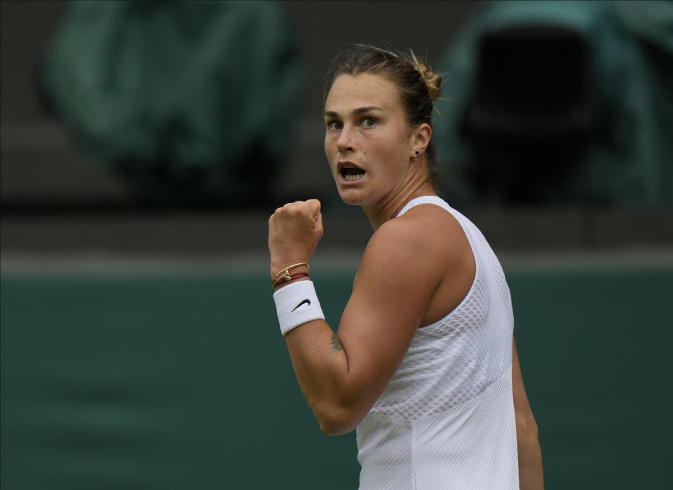 Belarus's Aryna Sabalenka celebrates winning a point against Britain's Katie Boulter during the women's singles second round match on day three of the Wimbledon Tennis Championships in London, Wednesday June 30, 2021. (AP Photo/Alastair Grant)