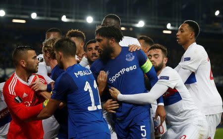 Soccer Football - Europa League - Everton vs Olympique Lyonnais - Goodison Park, Liverpool, Britain - October 19, 2017 Everton's Ashley Williams clashes with Lyon's Anthony Lopes as teammates intervene REUTERS/Andrew Yates