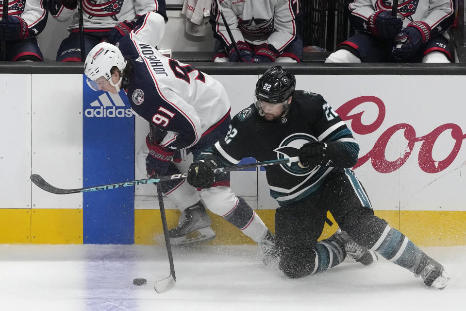 Columbus Blue Jackets center Kent Johnson (91) skates with the puck against San Jose Sharks center Ryan Carpenter (22) during the third period of an NHL hockey game in San Jose, Calif., Saturday, Feb. 17, 2024. (AP Photo/Jeff Chiu)