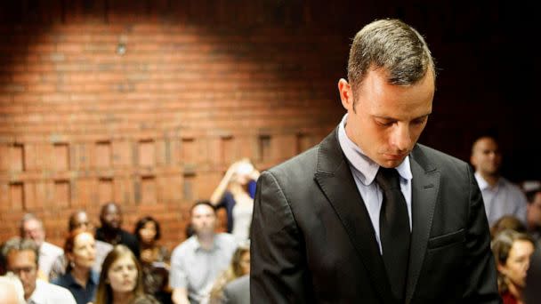 PHOTO: In this Feb 20, 2013 file photo Oscar Pistorius stands in the dock during a break in court proceedings at the Pretoria Magistrates court. (Siphiwe Sibeko1/Reuters, FILE)