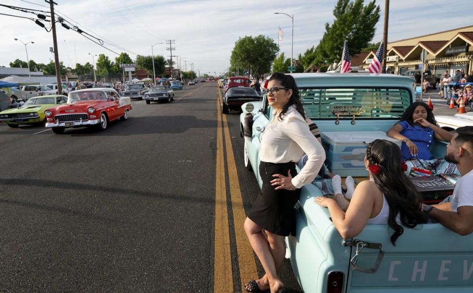 Rosie Solorio waits out gridlock on McHenry Avenue with her family in their 1962 Chevy C10 truck during the Graffiti Parade in Modesto, Calif., Friday, June 9, 2023. Andy Alfaro/aalfaro@modbee.com