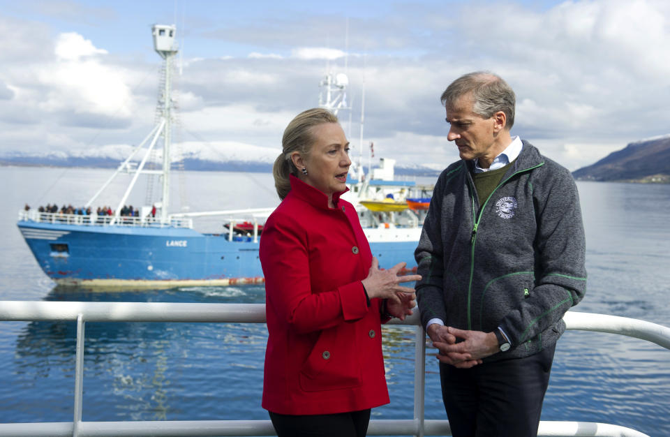 US Secretary of State Hillary Rodham Clinton and Norway's Minister of Foreign Affairs Jonas Gahr Stoere, right, talk together onboard the Arctic Research vessel Helmer Hanssen on a fjord, near the northern Norwegian city of Tromso, Norway, Saturday June 2, 2012. Clinton is trekking north of the Arctic Circle, a region that could become a new international battleground for resources. (AP Photo/Saul Loeb, Pool)