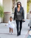 <p>Looking angelic on the way to ballet class while contrasting with mom’s edgy-rock look. (Photo: Getty Images) </p>