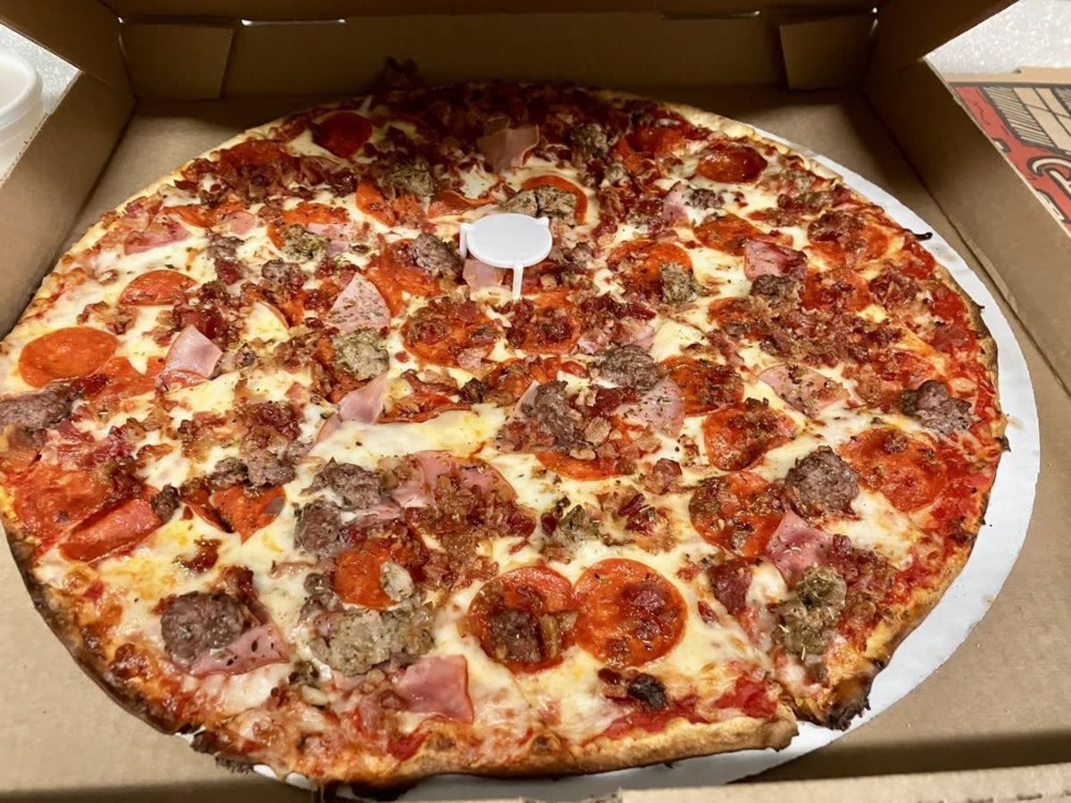 Pepperoni, sausage, and ham pizza in a pizza box, Frank & Helens, University City, Missouri