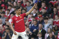 Manchester United's Casemiro celebrates after scoring his side's opening goal during the English Premier League soccer match between Manchester United and Chelsea at the Old Trafford stadium in Manchester, England, Thursday, May 25, 2023. (AP Photo/Dave Thompson)