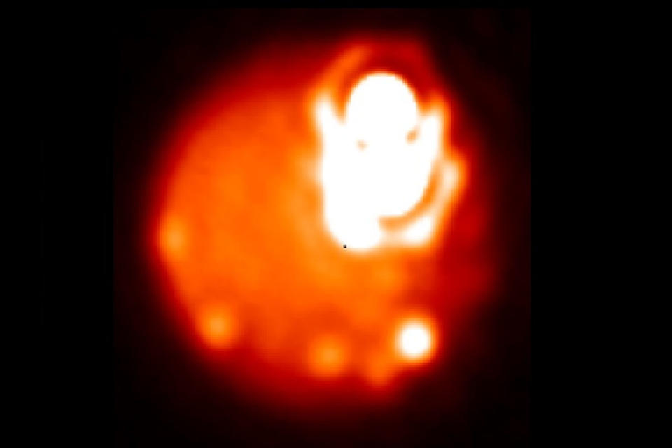 This high-resolution image of the volcanic regions Loki Patera and Amaterasu Patera on Jupiter's moon Io was captured from Earth using adaptive optics observations with the giant Keck and Gemini telescopes. <cite>Katherine de Kleer and Imke de Pater image, from Gemini Observatory/AURA & Keck Observatory</cite>
