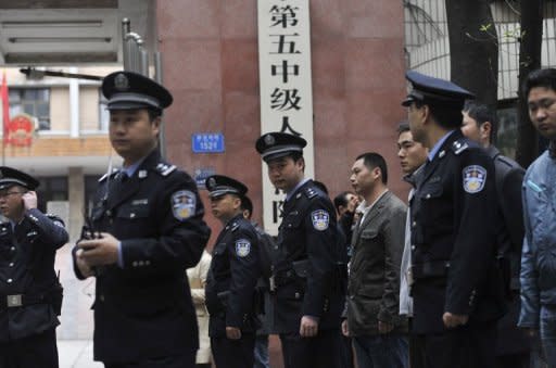 Chinese police stand guard outside the court in Chongqing prior to the verdict on the trial of mafia kingpin Wen Qiang in 2010. Bo Xilai was known for cracking down on organised crime in Chongqing, where ruthless mafia kingpins ran rampant for years