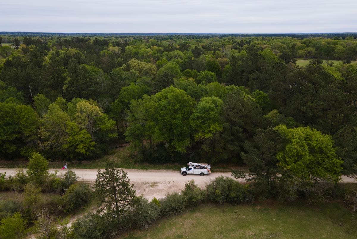 An aerial view of a utility truck parked on a gravel road March 20, 2023, in Nogalus Prairie, Texas.