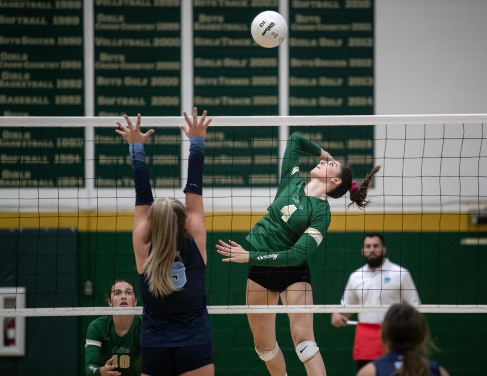 Giuliana Batelli of St. John Neumann hits over Marco Island Academy setter Madison Stolinas in the Class 2A Volleyball Regional Quarterfinals on Tuesday, Oct. 24, 2023, in Naples. Marco Island Academy won 3-1.