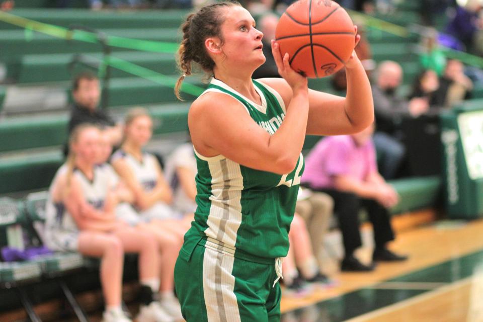 Brianna Heitkamp takes a jumper to score two points for Mendon in the regional semifinals on Monday.