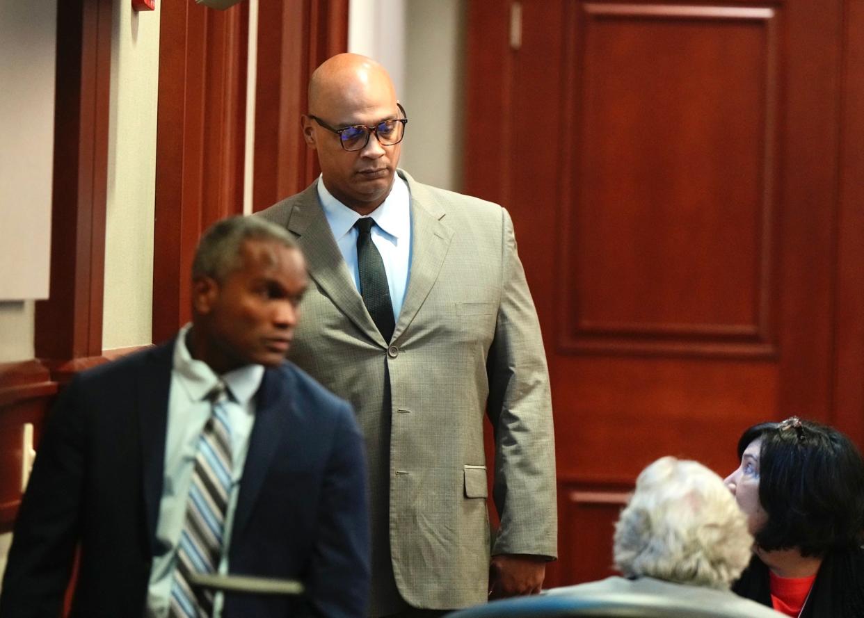 Jerone Hunter, front, and Troy Victorino enter the courtroom at the start of their penalty retrial Tuesday, April 25, 2023.